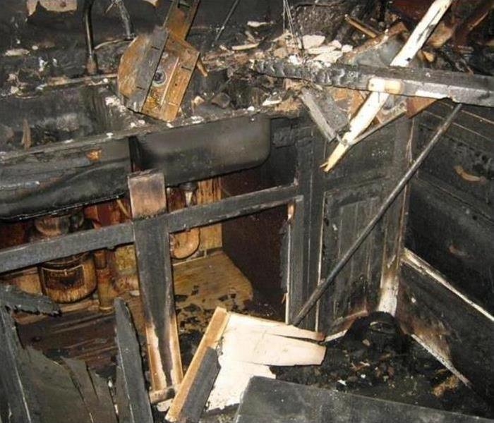 Fire damage destroys kitchen and soot is everywhere