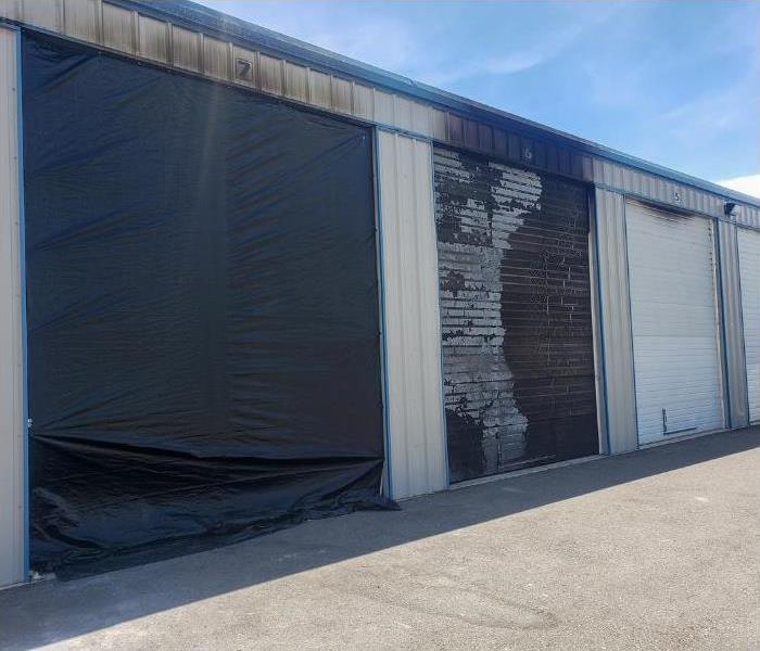 commercial building, garage, covered in soot after a business fire near me